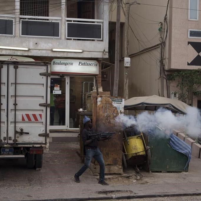 Police fire tear gas and protesters burn vehicles near home of Senegal's main opposition leader